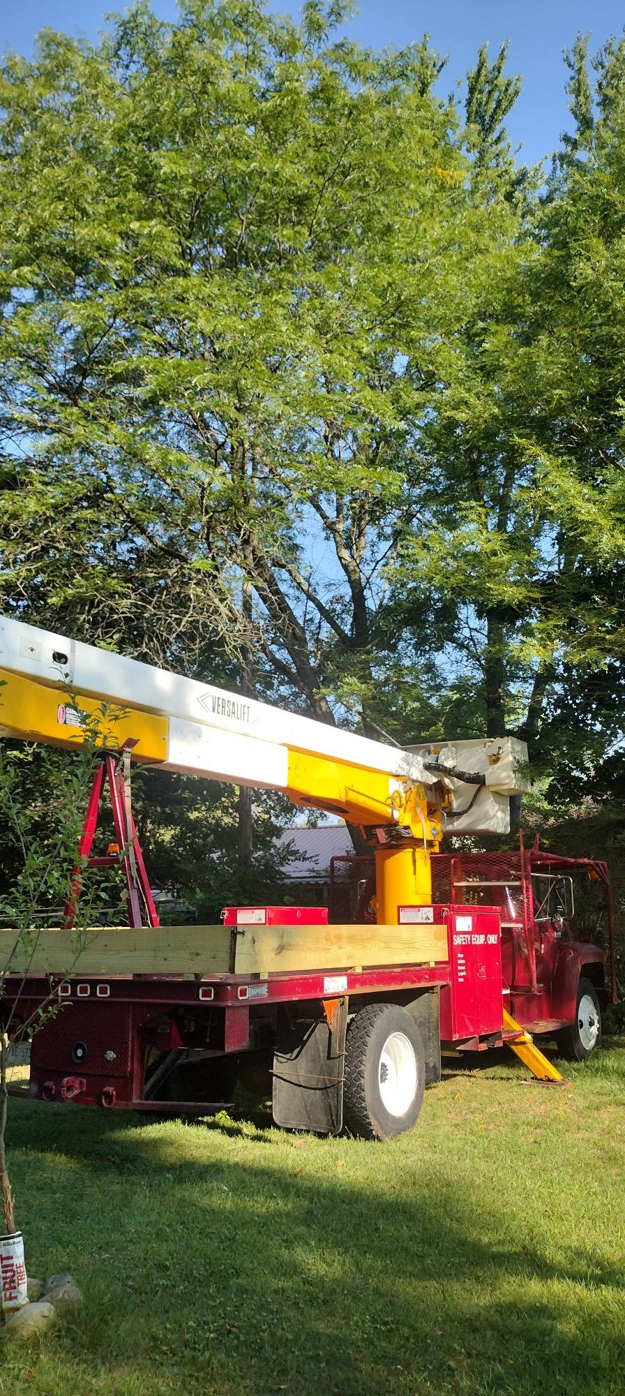 Red bucket truck ready for tree work